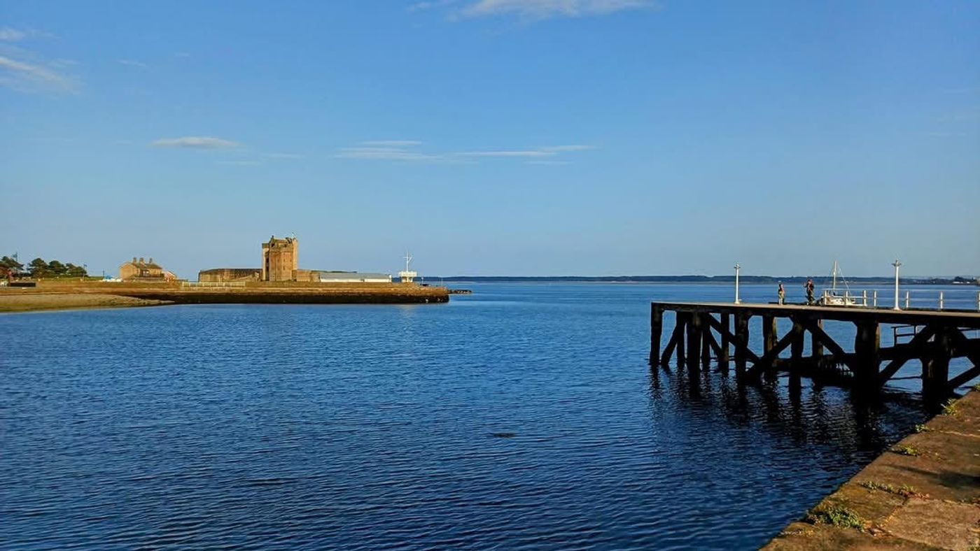 Calm water on the Tay, with the castle across the harbour